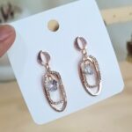 Stone-Studded Oval Dangler Earrings-blingytrends.com